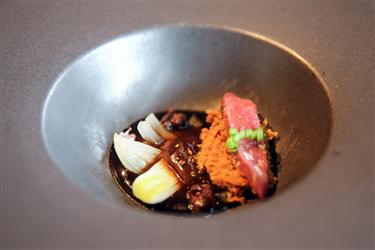 El Celler de Can Roca menu, Wood-pigeon liver with onion, curry-caramelized walnuts, juniper, orangepeel and herbs